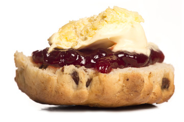 Dorset scone with clotted cream on top - obrazy, fototapety, plakaty