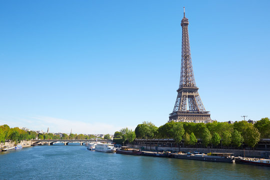 Eiffel tower and Seine river in a clear sunny day in Paris