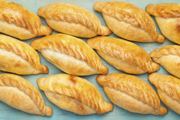 Kibinai  (kybyn,kybynlar,chiburekki,pelmeni,shishlik)  are traditional pastries filled with mutton and onion, popular with Karaite ethnic minority in Lithuania. 