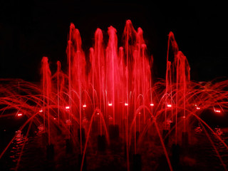 A beautiful fountain with red illumination