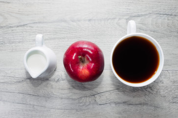 Milk, apple and coffee for breakfast