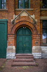Fototapeta na wymiar old door on brick wall