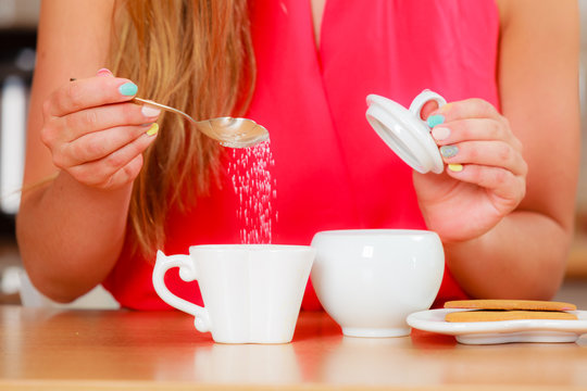 Human Adding Sugar To Tea Or Coffee.