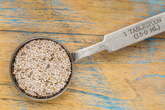 white chia seeds on a tablespoon
