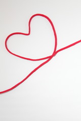Red heart string, on white background 