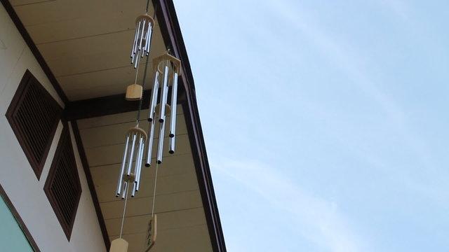 Oriental wind bells ringing with blue sky, stock video