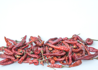 chillies dried in the sun on white background