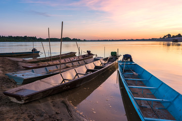 Fototapeta na wymiar Boats on the Mekong River at sunset