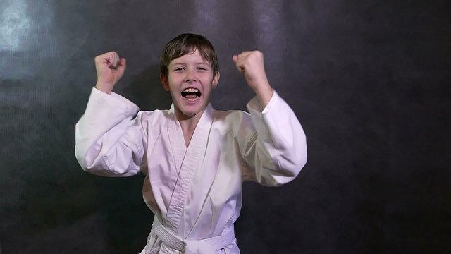 Karate boy screaming kid success teenager victory rejoices slow motion