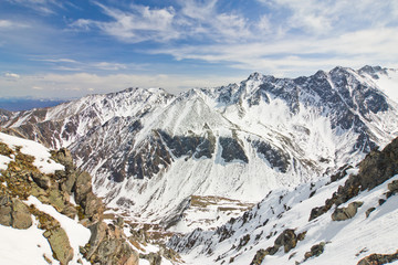 Fototapeta na wymiar Landscape of the peaks of the Eastern Sayan in the snow
