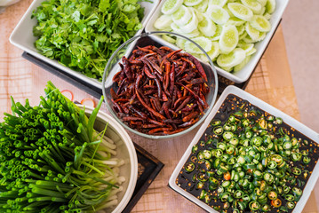 Types of Thai food's ingredients, fresh scallion, dried red hot chili, Sliced cucumbers, black soy...