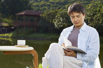 man reading outdoor in morning