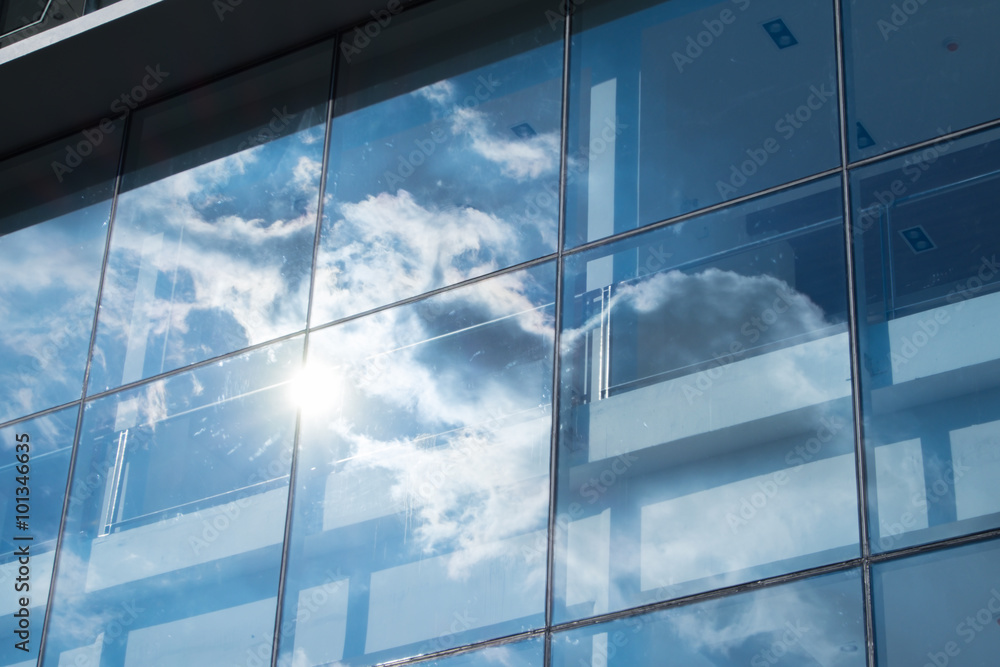 Poster sun ray and blue sky reflection on window office building, busin