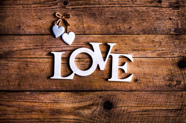 Word ''love'' on a old wood planks. St. Valentine's Day