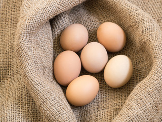 Fresh farm eggs on sackcloth