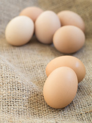 Fresh farm eggs on sackcloth