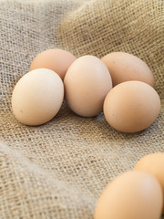 Fresh farm eggs on sackcloth