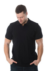Fototapeta premium Handsome Man In Casuals Standing With Hands In Pockets