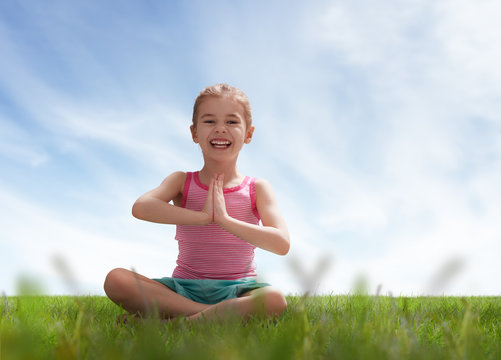 child practicing yoga