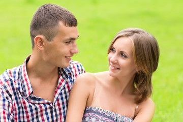 Fototapeta premium Young man and woman looking at each other