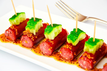 Cocktail Sausage and Cucumber on Plate