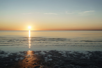 sunset above sea shot from beach