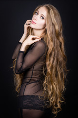 Naklejka premium Beautiful girl in fishnet dress with gorgeous very long hair