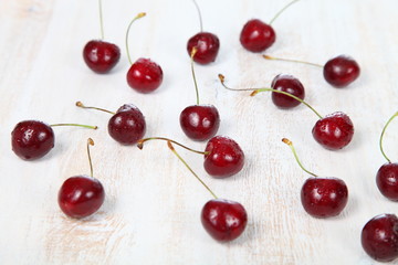 Naklejka na ściany i meble Ripe cherry in a wooden bowl