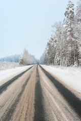 Obraz premium Snowy winter road during blizzard in Latvia