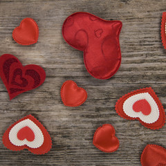 Hearts on a wooden background.