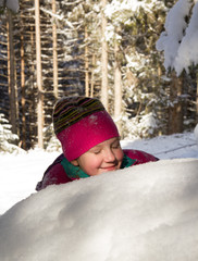Fototapeta na wymiar Happy children sledding at winter time. Group of children spendi