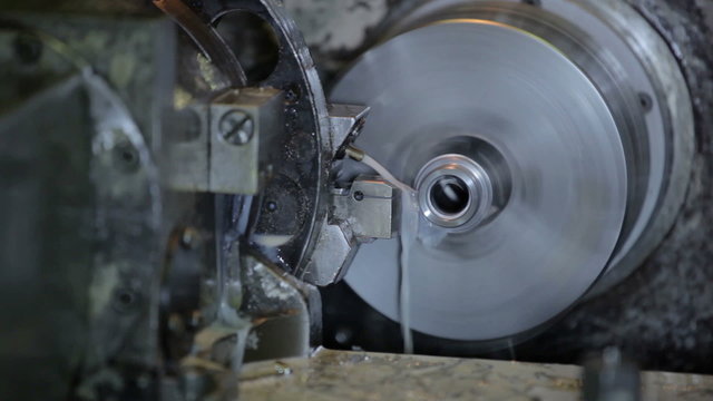 Industrial lathe works metal with precision