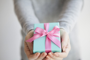 Women have received a gift box of pink ribbon