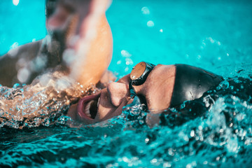 Freestyle swimming action, closeup detail from the swimming race