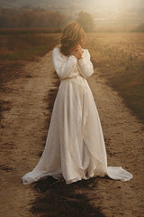 Fototapeta na wymiar Woman with vintage bride dress