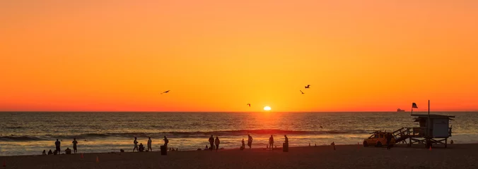 Fototapeten Beach at orange sunset, Manhattan Beach, Los Angeles, California © lucky-photo