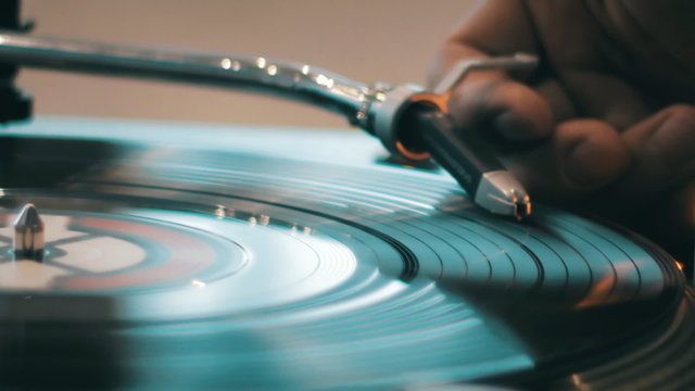DJ scratching on the Decks at a disco  Nightclub