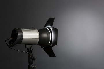 modern source of pulsed light with a reflector on a dark background