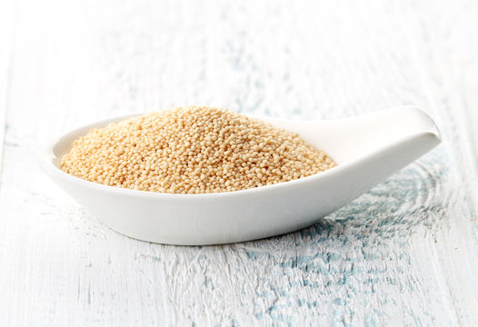 Amaranth seeds in porcelain spoon