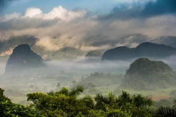 Peaceful view of Vinales valley at sunrise. Aerial View of the Vinales Valley in Cuba. Morning twilight and fog. Fog at dawn in the Valley of Vinales in Pinar del Rio