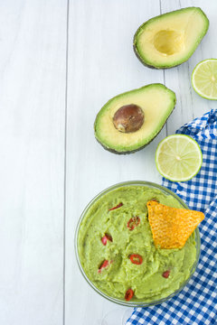 Guacamole with nachos and lime

