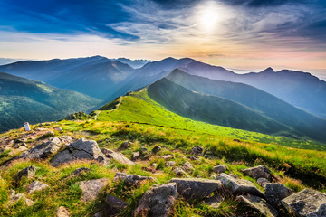 Naklejka premium Wonderful sunset in mountains in summer