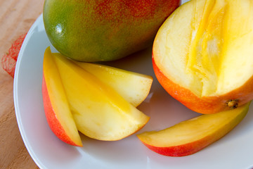 Mango fruit on wooden background.