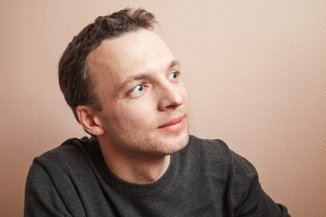 Obraz premium Young positive handsome Caucasian man studio portrait