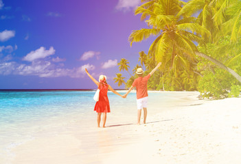 happy loving couple on tropical beach