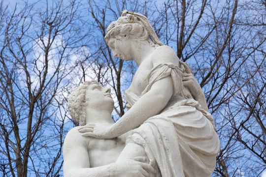 White Stone Statue Of Man And Woman