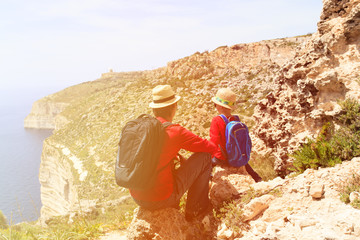 Fototapeta na wymiar father and son travel in scenic mountains