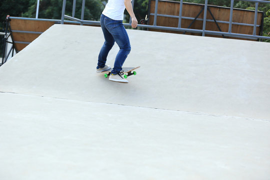 skateboarding legs at skatepark