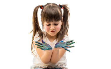 Funny little girl with hands painted in colorful paint