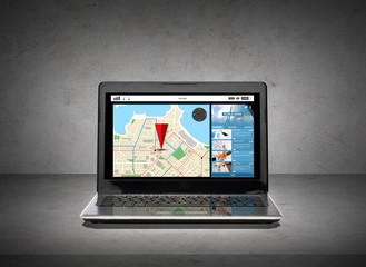 laptop computer with gps navigator map on screen